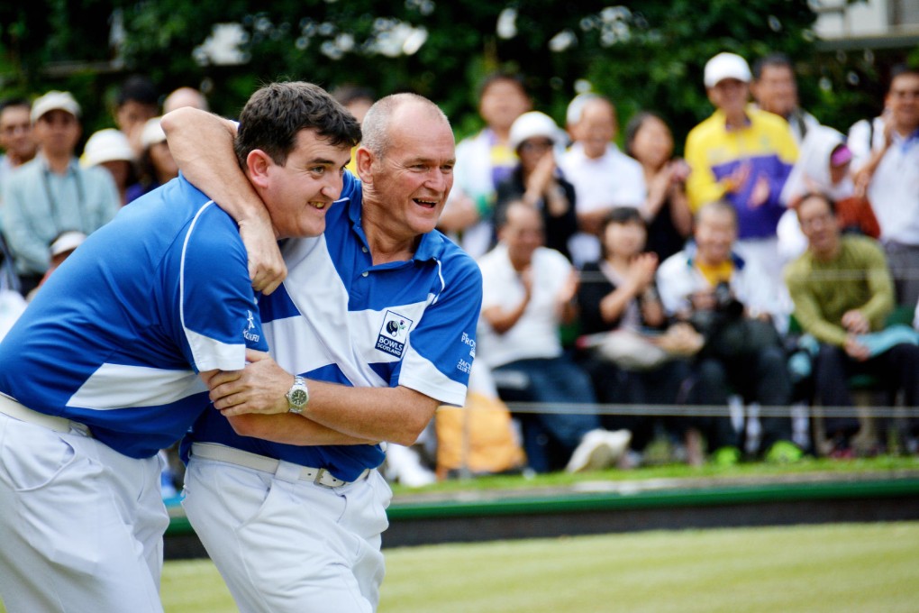 Iain McLean (left) and Robert Grant of Scotland congratulate each other after winning the Classic men's pairs title. Photo: SCMP Pictures