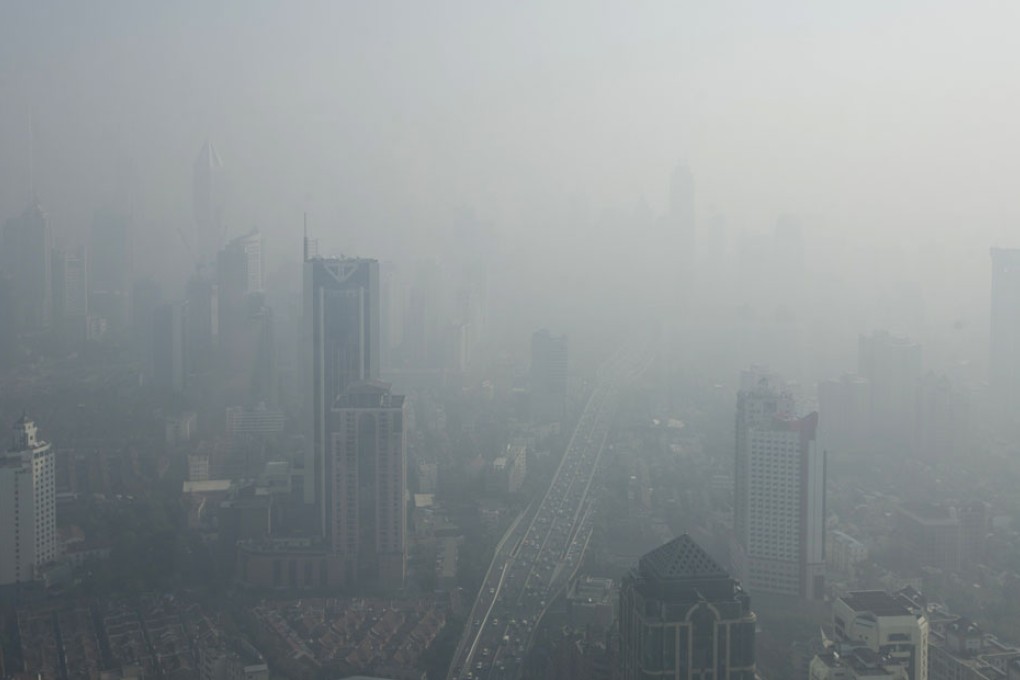 Buildings are seen through thick haze in downtown Shanghai. Photo: Reuters