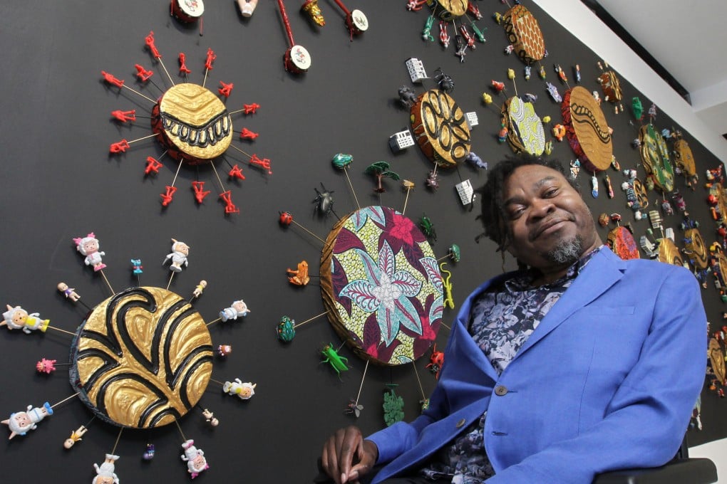 Yinka Shonibare with his art installation entitled Hong Kong Toy Painting. Photo: Edward Wong