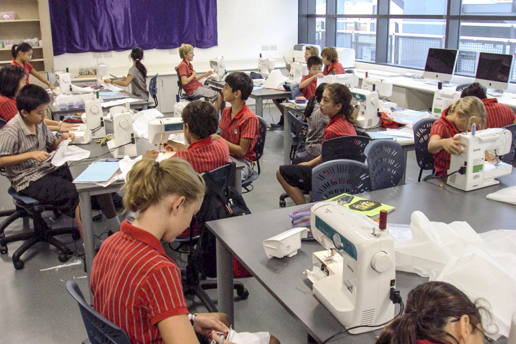 A sewing lesson at Discovery College, where parents kept tuition fees from rising. That changes next month. Photo: Dr Wesley Fryer