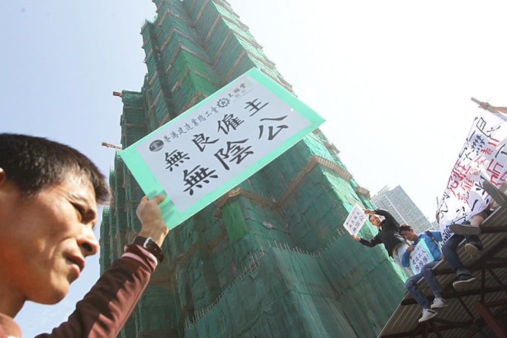 Striking workers protest outside the Lohas Park construction site in Tseung Kwan O about not being paid by for months by the sub-contractor. Photo: Sam Tsang