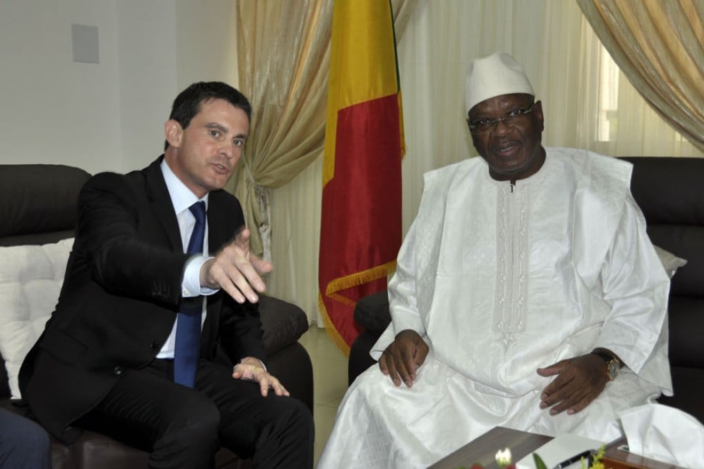 Malian President Ibrahim Boubacar Keita (right) and French Interior Minister Manuel Valls chat before a meeting at the presidential palace in Bamako. Photo: AFP