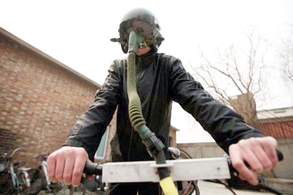 Artist Matt Hope and his "breathing bicycle", which features an air filtration system fixed to the rider's helmet. Photo: SCMP