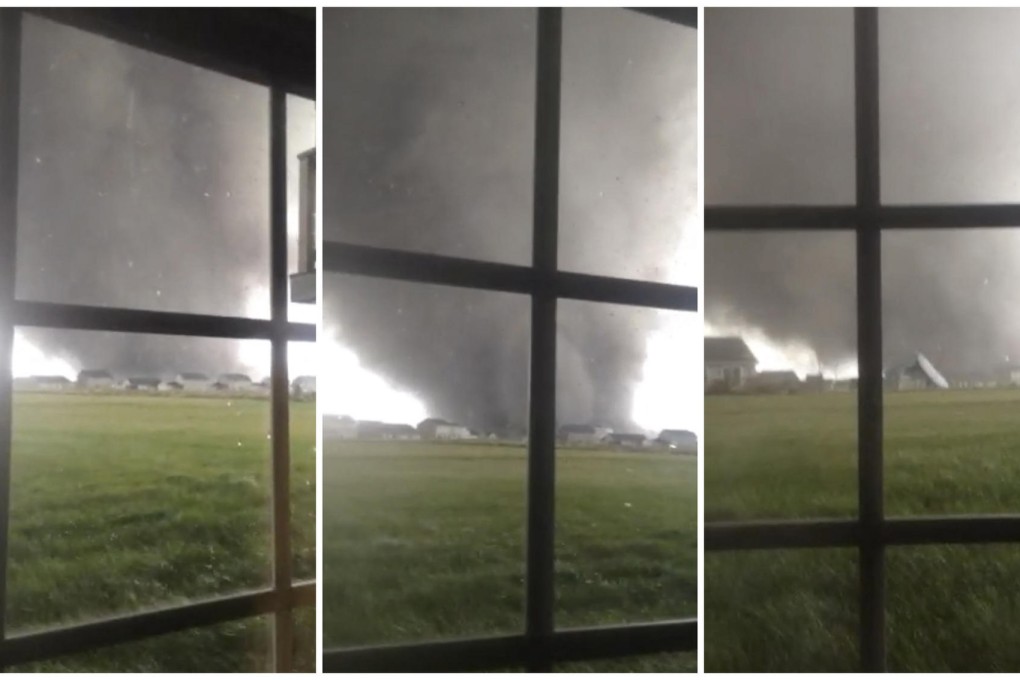 The tornado as seen through three photos taken from a window as it touches down in Washington, Illinois. At least five people were killed. Photo: Reuters