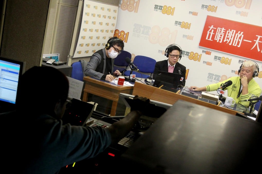 Commercial Radio's Stephen Chan (centre) interviews TVB's Nat Chan (in yellow) on his morning talk show yesterday. Photo: David Wong