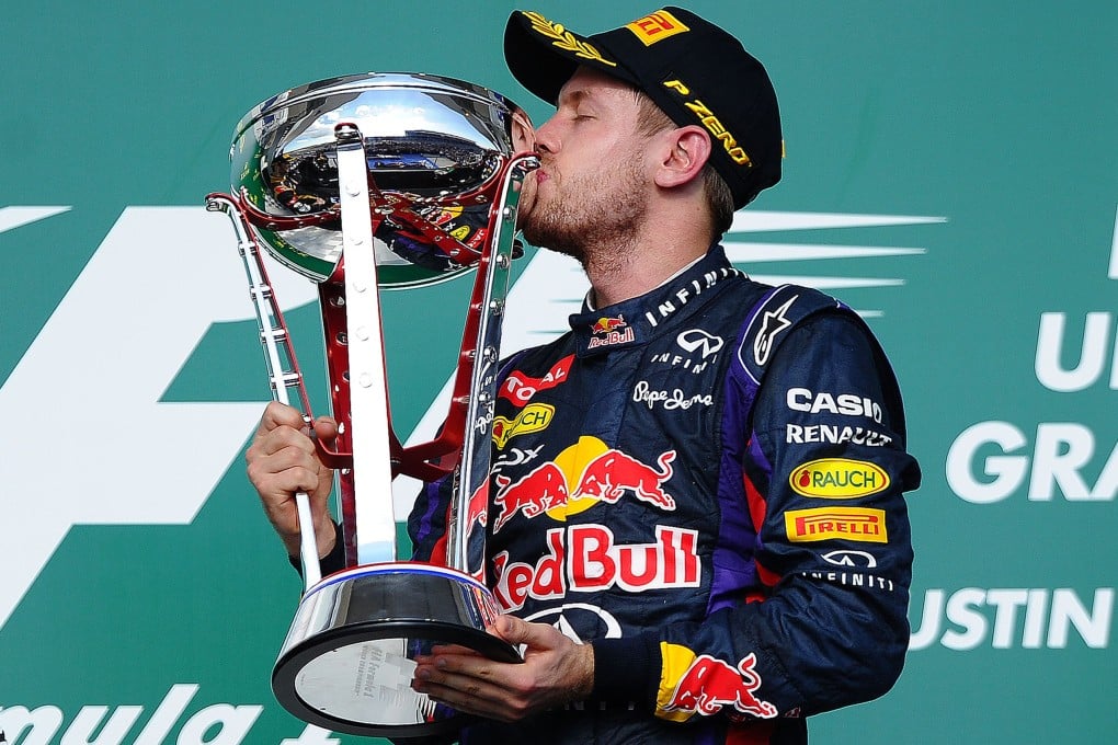 Red Bull's German driver Sebastian Vettel kisses the trophy after winning the United States Formula One Grand Prix  in Austin, Texas. Photo: AFP