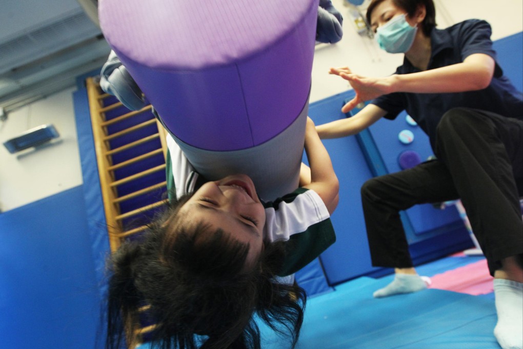 Rainbow Cheng, 6, enjoys an occupational therapy session at the school. Photo: David Wong