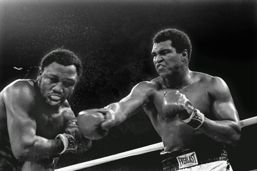 Muhammad Ali socks Joe Frazier in the Thrilla in Manila. Photo: AP