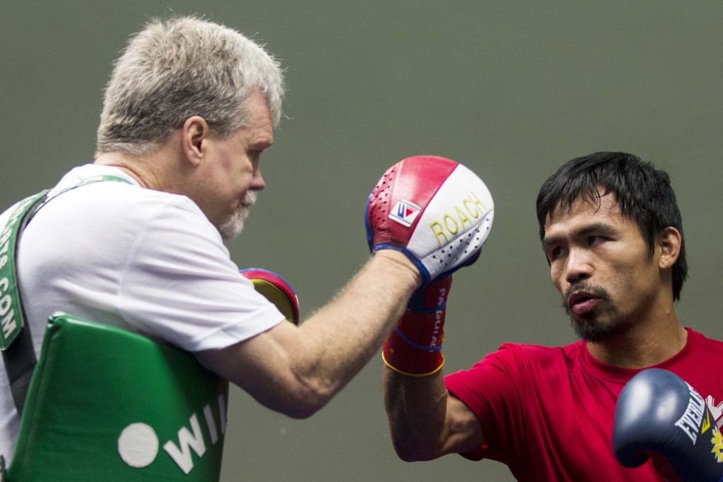 Trainer Freddie Roach says Manny Pacquiao told him he would take care of Brandon Rios "quickly". Photo: Reuters