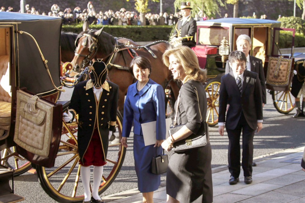 Newly appointed US ambassador to Japan Caroline Kennedy walks to a waiting Imperial carriage to take her to the Imperial Palace in Tokyo. Photo: EPA