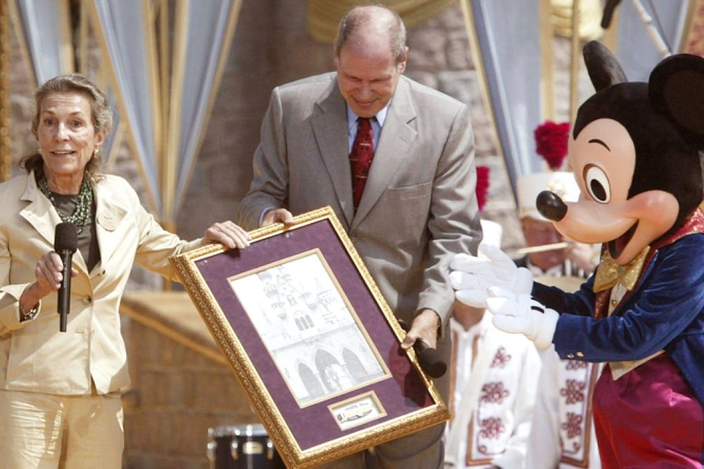 Diane is presented with a photo of her father at Disneyland's 50th birthday party in Anaheim, California, in 2005. Photo: EPA