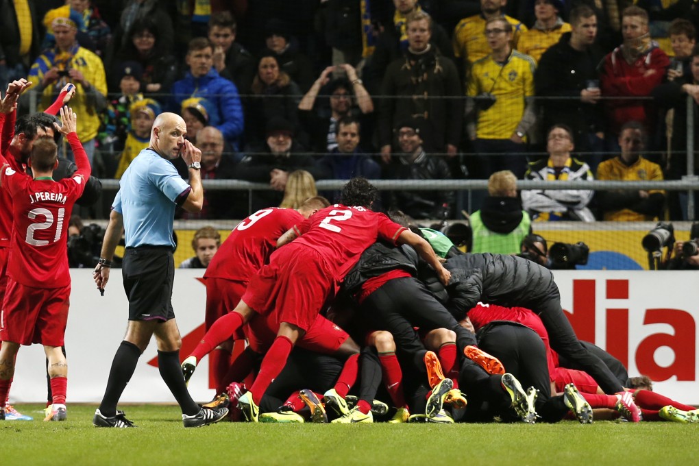 Referee Howard Webb has been at the centre of media attention over his decisions in Sweden and Portugal's second leg game. Photo: AP