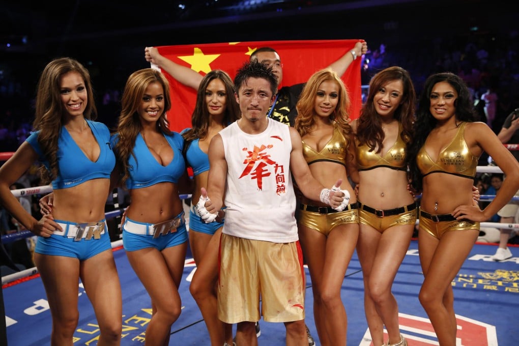 Zou Shiming could be the star Chinese boxing needs - but some mainland media outlets seem more interested in ring girls. Photo: AP