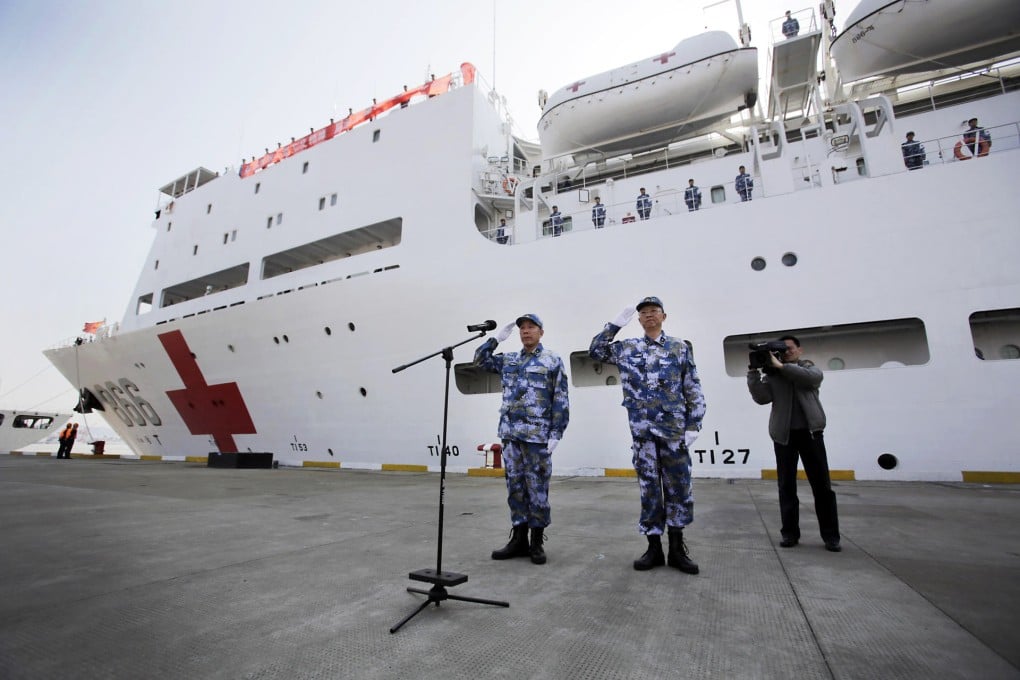 Rear Admiral Shen (left) gives a salute before departure. Photo: AP