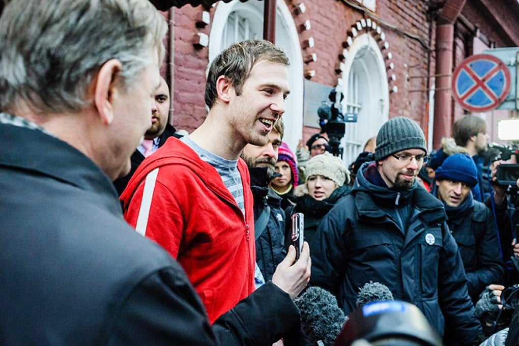 Freelance videographer Kieron Bryan (centre) from Britain is released on bail from the SIZO 4 detention centre in St Petersburg, Russia, on Friday. Photo: EPA