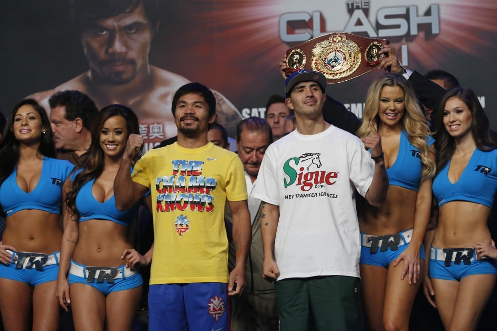 Filipino Manny Pacquiao and American Brandon Rios are relaxed during their weigh-in on Saturday on the eve of their WBO welterweight title fight at the Venetian in Macau. Photo: AP