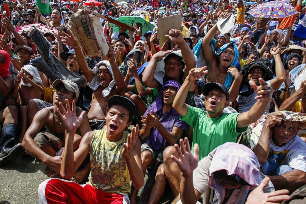 Tacloban residents celebrate Pacquiao's victory. Photo: Reuters