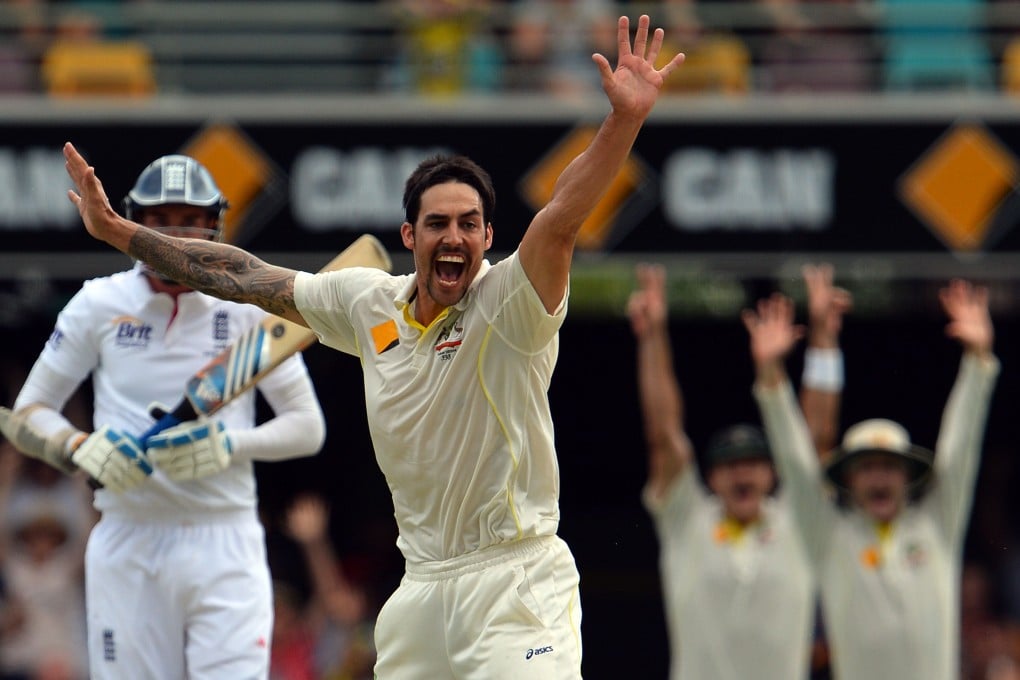 Australian speedster Mitchell Johnson  celebrates the dismissal of England's Stuart Broad. Photo: AFP