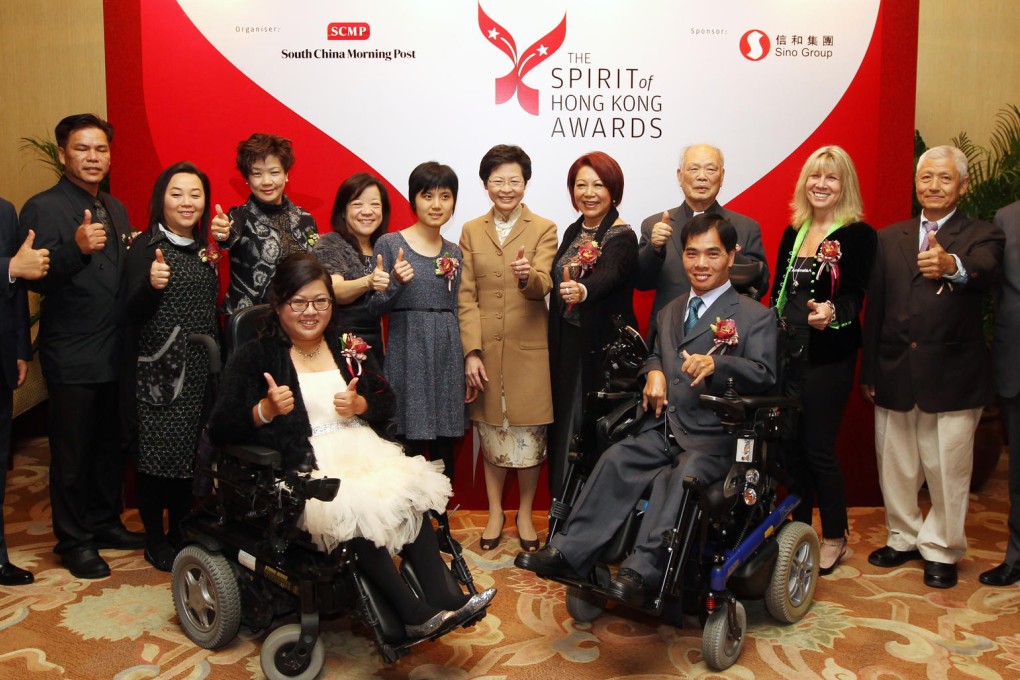 (Front, left to right) Carmen Yau and Willy Law; (back, left to right) Robin Hu, CEO of SCMP Group; Lee Ming-sun; Elsa Tse Ngar-yee; Elana Ho; Chan Kit-ying; Tsang Tsz-kwan; Chief Secretary Carrie Lam; Jenny Law Chun-heung; Pastor Lee Mo-fan; Jill Robinson; Kan Yiu-kwong; and Dr David Pang Ding-jung, chairman of SCMP Group.Photo: Felix Wong