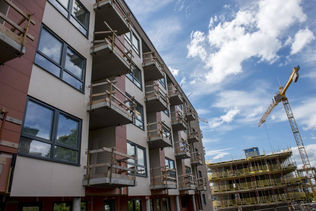 A crane operates on a construction site for new residential apartments in the Loren district of Oslo. Photo: Bloomberg