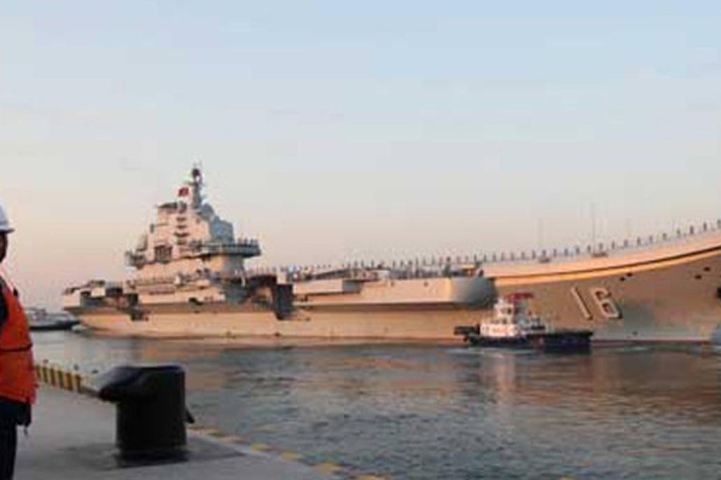 China's first aircraft carrier the Liaoning prepares to set off at dawn yesterday for training exercises in the South China Sea. Photo: Xinhua