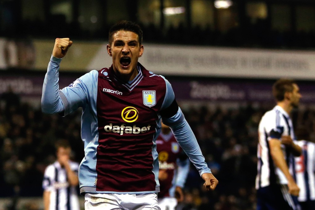 Aston Villa midfielder Ashley Westwood celebrates scoring his team's second goal to equalise during the English Premier League match against West Bromwich Albion. Photo: AFP