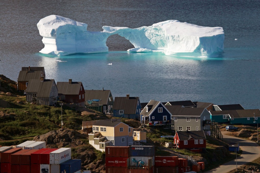 An iceberg floats near the town of Kulusuk east Greenland. The Arctic, Greenland and the oceans, among many other places, has noted accelerating climate change. Photo: Reuters