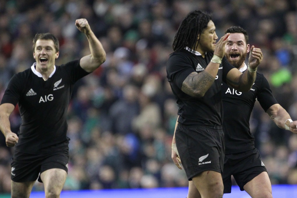 Ben Smith, Ma'a Nonu and Ryan Crotty celebrate after putting the icing on the cake against the Irish. Photo: AP