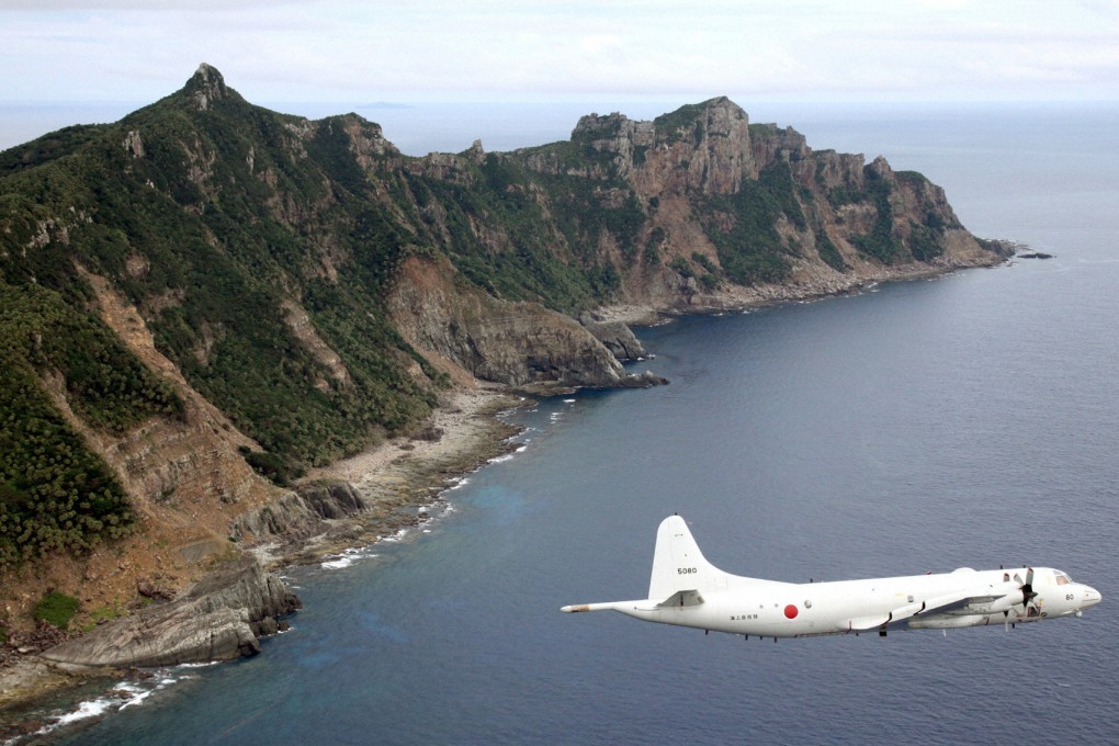 File photo of Japan Maritime Self-Defense Force's PC3 surveillance plane flying around disputed islands in the East China Sea. Photo: Reuters