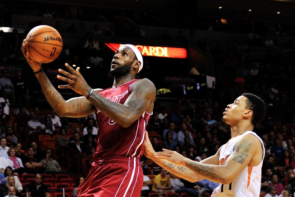 Miami Heat's LeBron James drives to the basket as Phoenix Suns shooting guard Gerald Green defends during their clash in Miami. Photo: USA Today