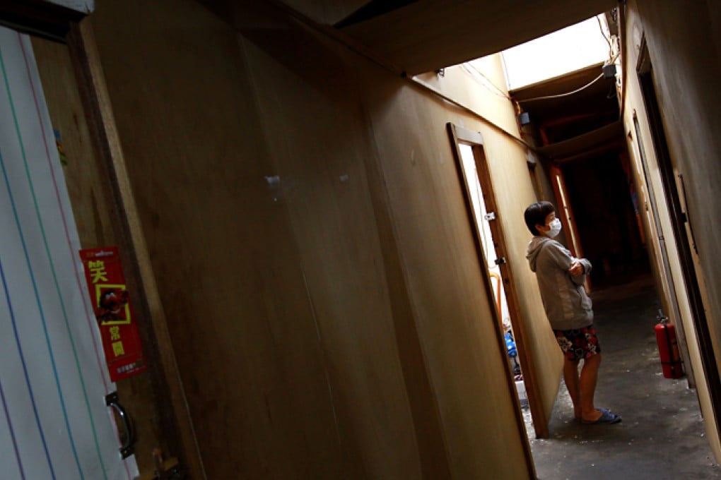 Resident lives in a cubicle flat. Photo: David Wong