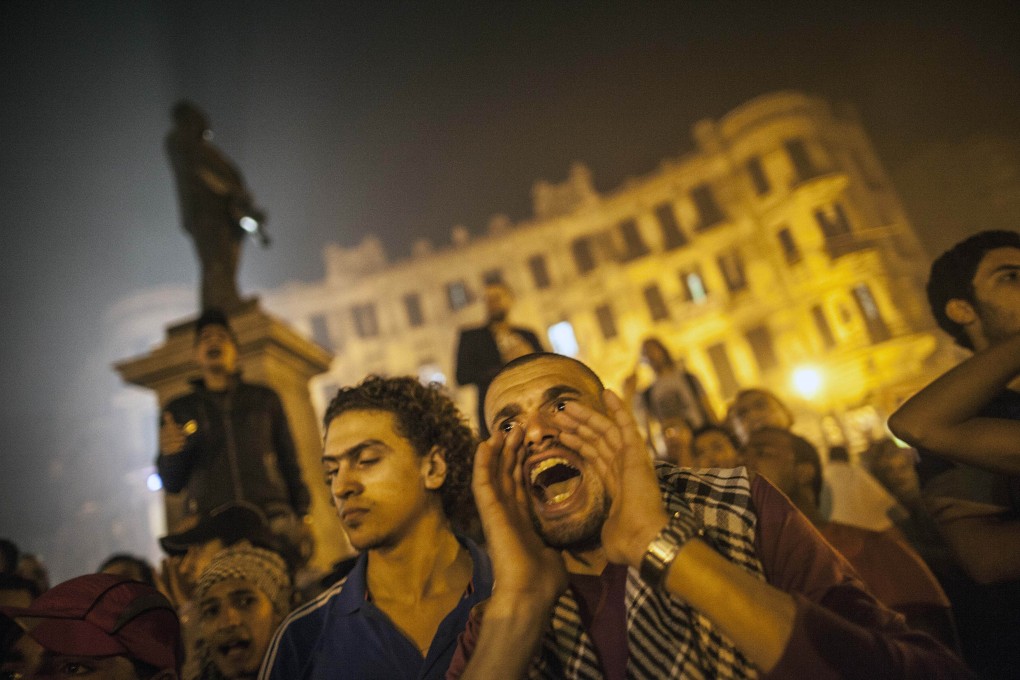 A protester shouts slogans at a rally in Talaat Harb Square in downtown Cairo on Tuesday. Photo: Xinhua