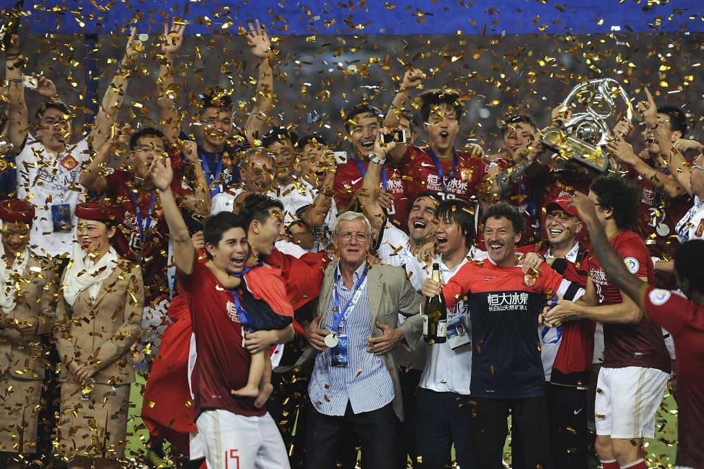 Marcello Lippi, who still has a year on his Guangzhou contract, celebrates with the team after their Champions League success. Photo: AP
