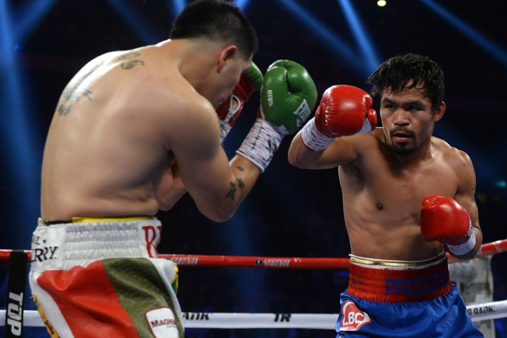 Manny Pacquiao in action in The Clash in Cotai, but he has another fight on his hands back home in the court over taxes. Photo: AFP