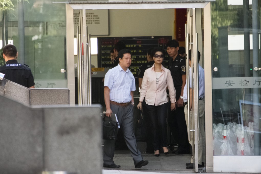 Defendant Li Guanfeng''s mother, Meng Ge, leaves court in Beijing''s Haidian district during the first-instance trial in August. Photo: CNS