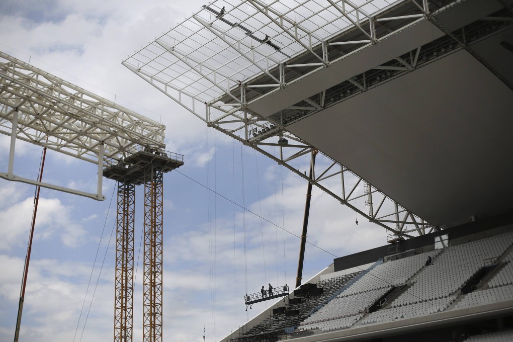 Two people died on Wednesday after a crane collapsed at the site of the "Itaquerao" stadium, which will host the opening match of the 2014 World Cup. Photo: Reuters