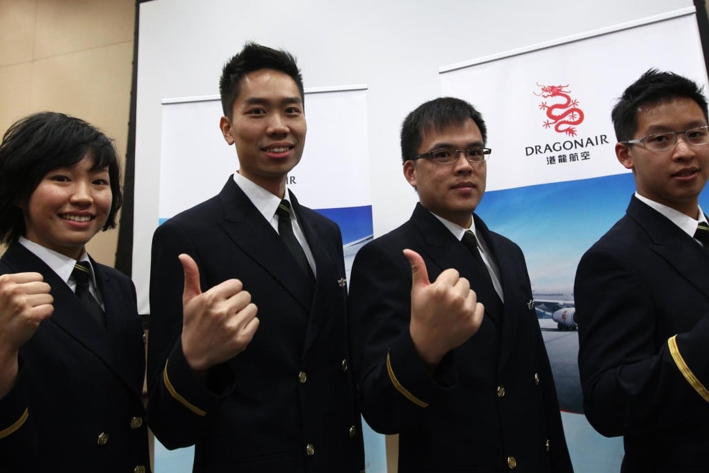 Cadet pilot graduates (from left) Tina Tsang, David So, Isaac Chan and Marco Chan. Photo: Jonathan Wong