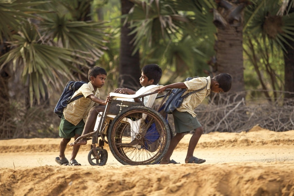 Samuel, a disabled 13-year-old, is wheeled to school by his brothers. The 5km journey is one of four detailed in On the Way to School, a French documentary.