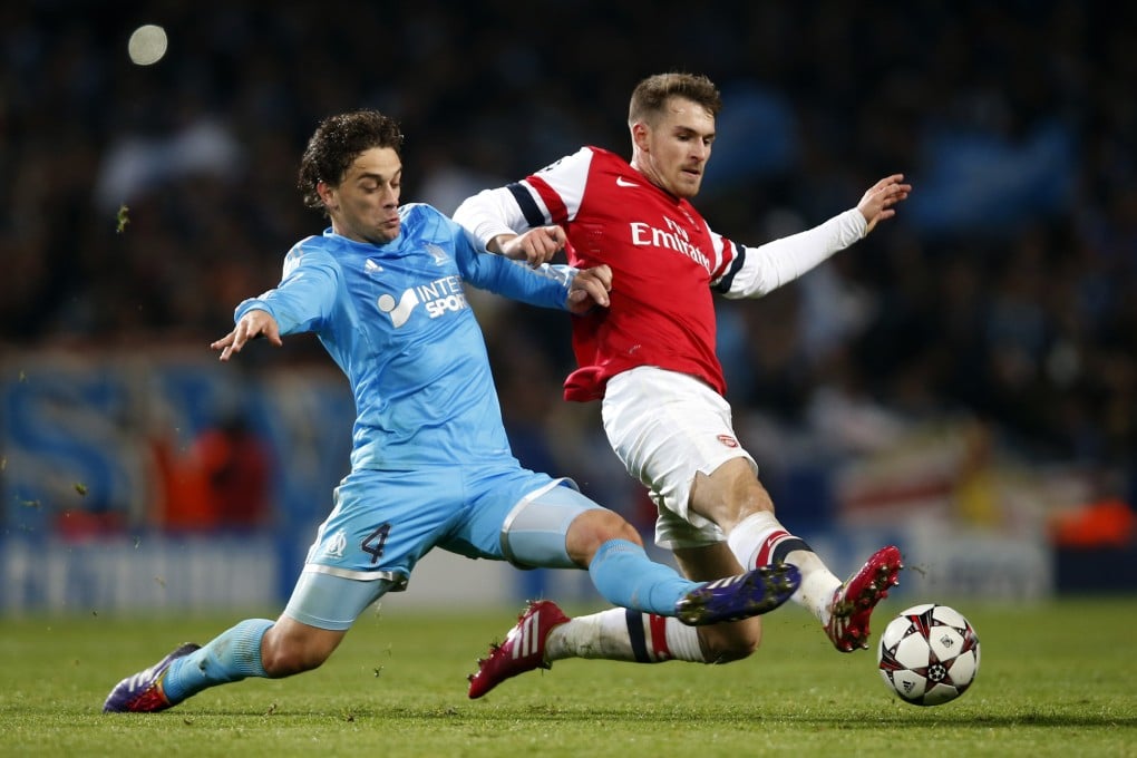 Arsenal's Aaron Ramsey vies with Lucas Mendes of Marseille in their Uefa Champions League match at Emirates Stadium. Photo: Xinhua