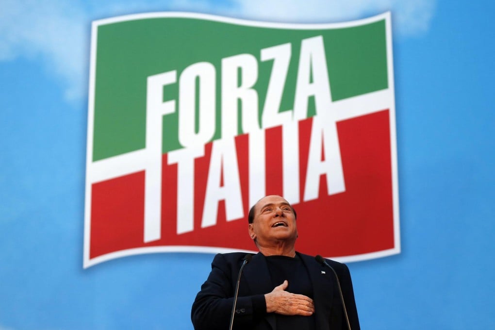 Silvio Berlusconi delivers a speech to supporters outside his palace in central Rome after he was expelled from the Senate. Photo: Reuters