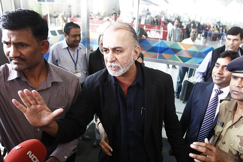 Tarun Tejpal, the 50-year-old founder and editor-in-chief of India's leading investigative magazine Tehelka, speaks with the media upon his arrival at the airport in New Delhi on his way to Goa, on Friday. Photo: Reuters