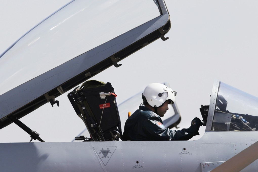 A pilot sits in the cockpit of a Jian-10 fighter jet at Yangcun Air Force base on the outskirts of Tianjin municipality. Photo: Reuters