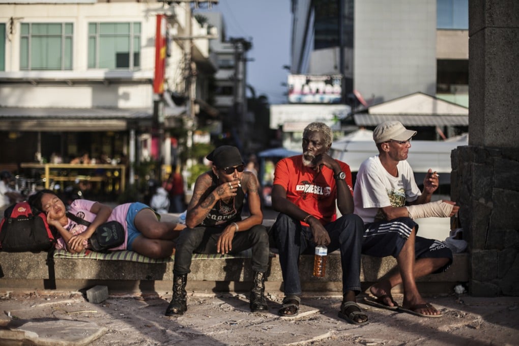 Sylvester (second from right), from the United States, and Alex of Denmark (far right), in Pattaya, Thailand.