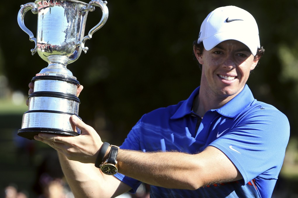 Northern Ireland's Rory McIlroy holds aloft the trophy after winning the Australian Open tournament at Royal Sydney Golf Club. Photo: Reuters