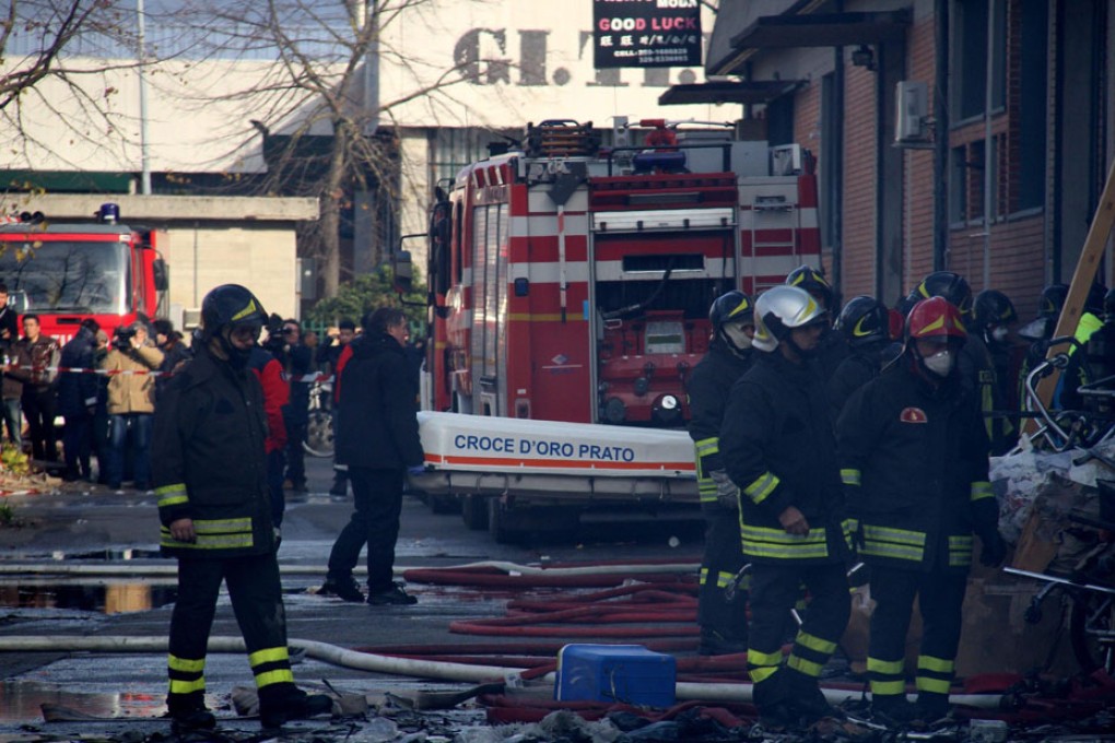 Firefighters work at the scene of a deadly blaze at a Chinese-owned
garment factory in Prato, Tuscany, at the weekend. Photo: EPA
