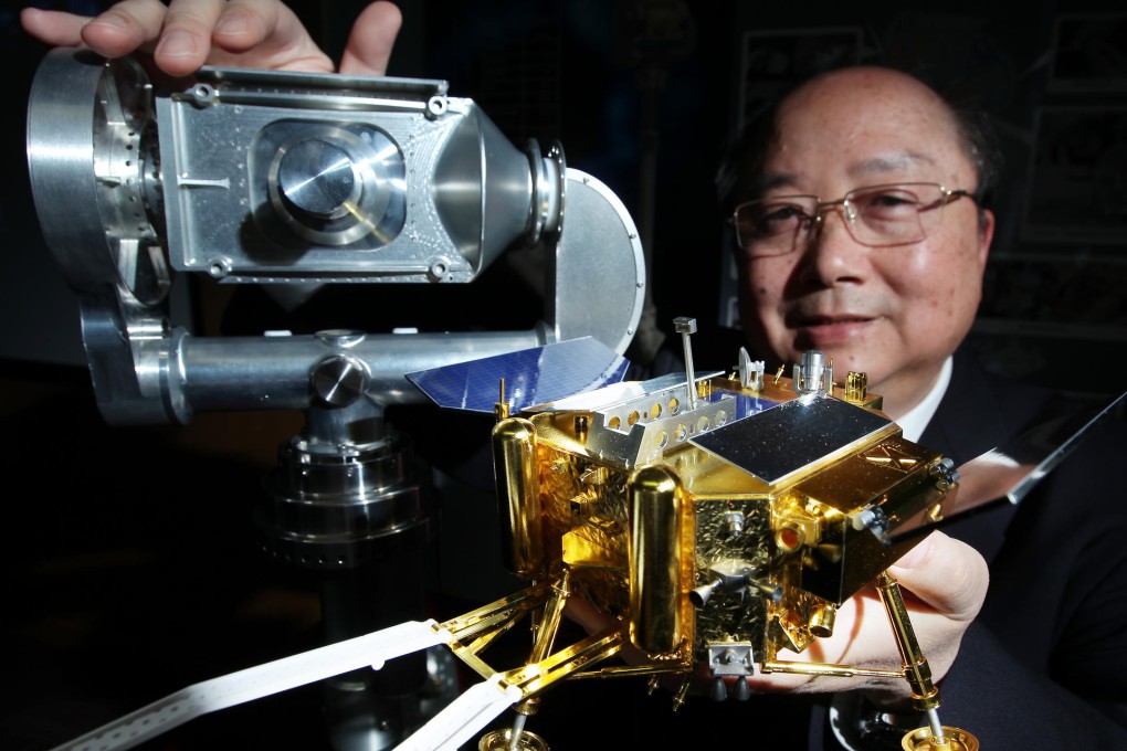 Professor Yung Kai-leung with the Camera Pointing System he developed at PolyU. Photo: Nora Tam