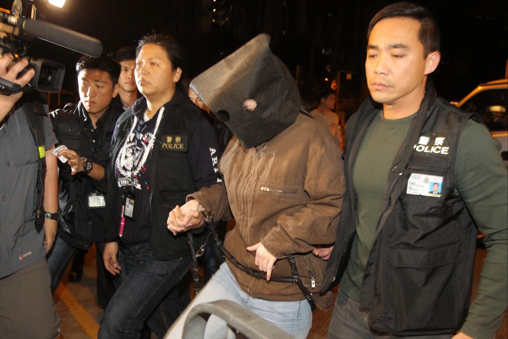 Police take the suspect to her home today. Photo: K. Y. Cheng