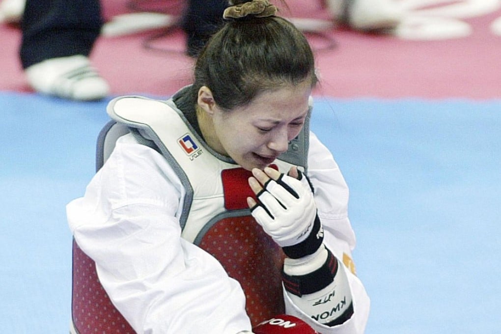 Yang Shu-chun of Taiwan cries after she was disqualified from the 2010 Asian Games taekwando competition. Photo: Reuters