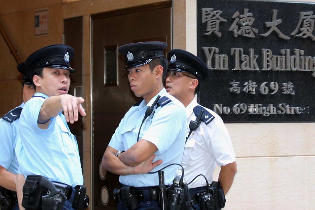 Police officers investigate after the man was subdued yesterday. Photo: Dickson Lee