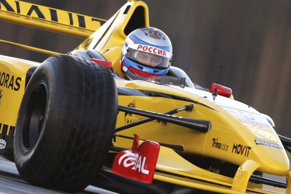 Russian President Vladimir Putin enjoys a spin in a Formula One car in 2010. His country will host a F1 race for the first time next year. Photo: AP